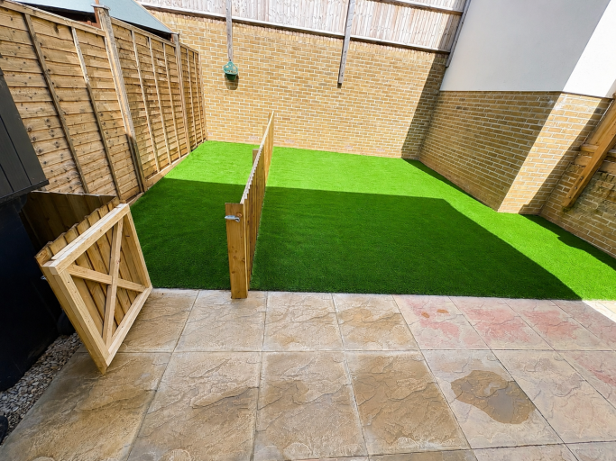 Artificial Grass Garden Installation New artificial grass lawn in a fenced garden in Weston-Super-Mare.