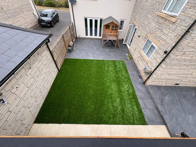 Artificial Grass Installation New artificial grass lawn in a paved garden in Weston-Super-Mare.